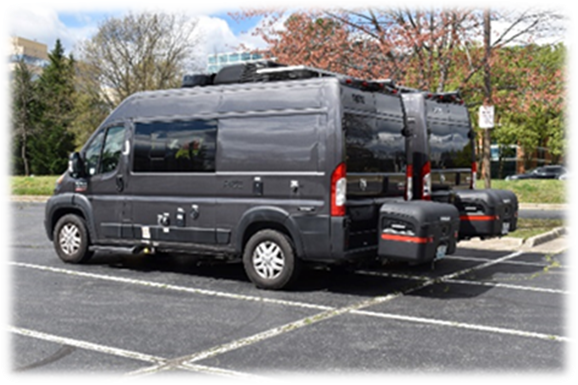 Two parked RVs